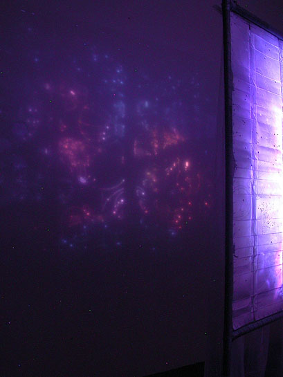 The First Occupation, 2005, detail (light projection through perforations onto wall)